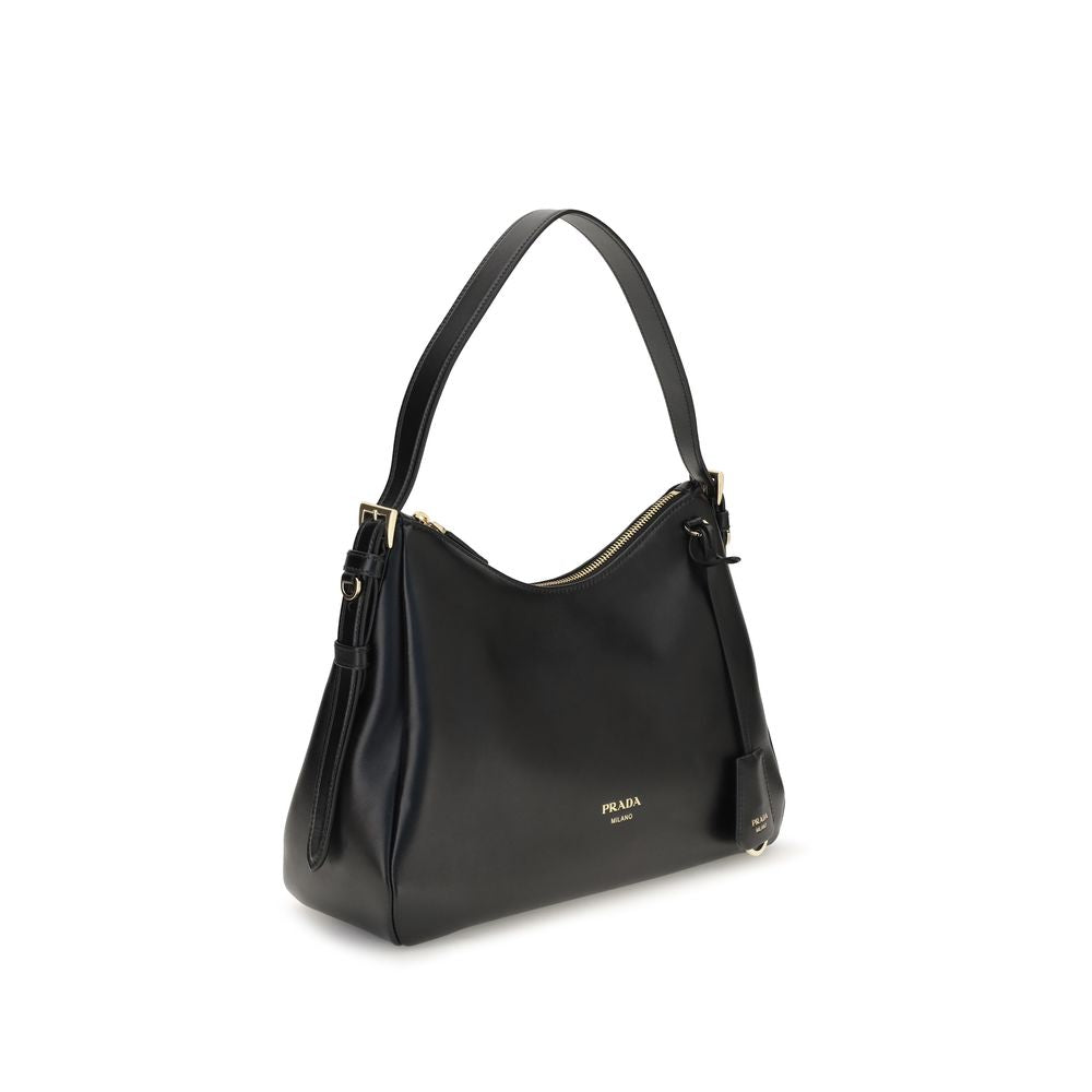Shoulder Bag by Prada for women in bos taurus calf leather black features an effortlessly chic silhouette with a secure zipper, ample , and versatile shoulder-strap & adjustable-strap for effortlessly chic everyday luxury.