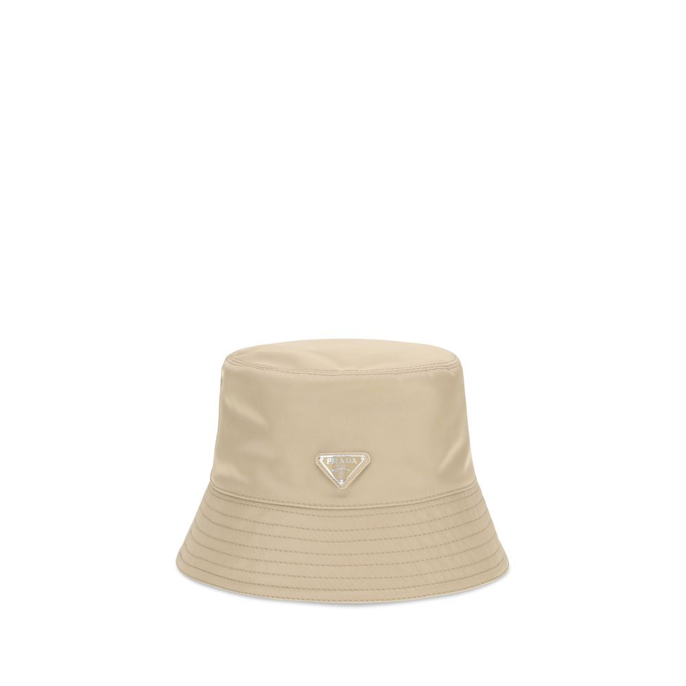 This Bucket Hat by Prada for men in nylon beige presents a effortlessly chic silhouette, showcasing the refined aesthetic and effortlessly chic craftsmanship of the Nylon Bucket Hat.