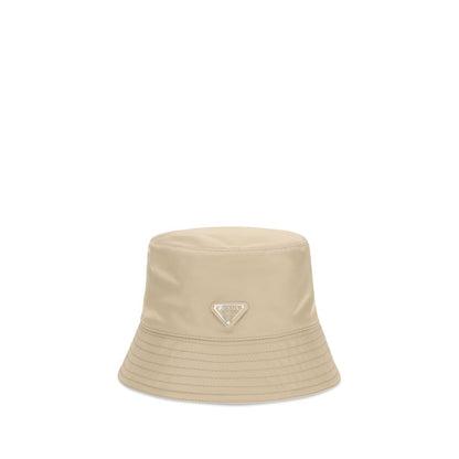 This Bucket Hat by Prada for men in nylon beige presents a effortlessly chic silhouette, showcasing the refined aesthetic and effortlessly chic craftsmanship of the Nylon Bucket Hat.