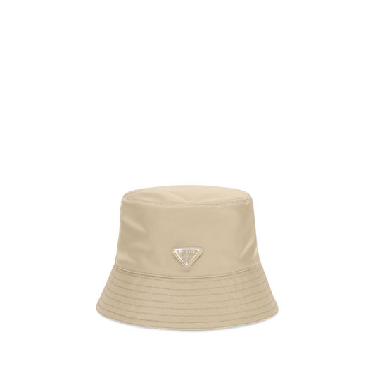 This Bucket Hat by Prada for men in nylon beige presents a effortlessly chic silhouette, showcasing the refined aesthetic and effortlessly chic craftsmanship of the Nylon Bucket Hat.