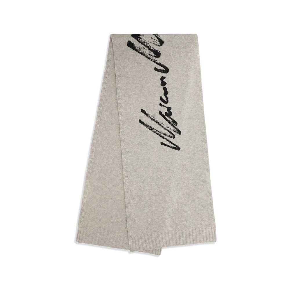 Scarf by MM6 for women in wool gray & signature features a snug silhouette, perfectly showcasing the elegant drape and premium finish of the Wool Scarf.