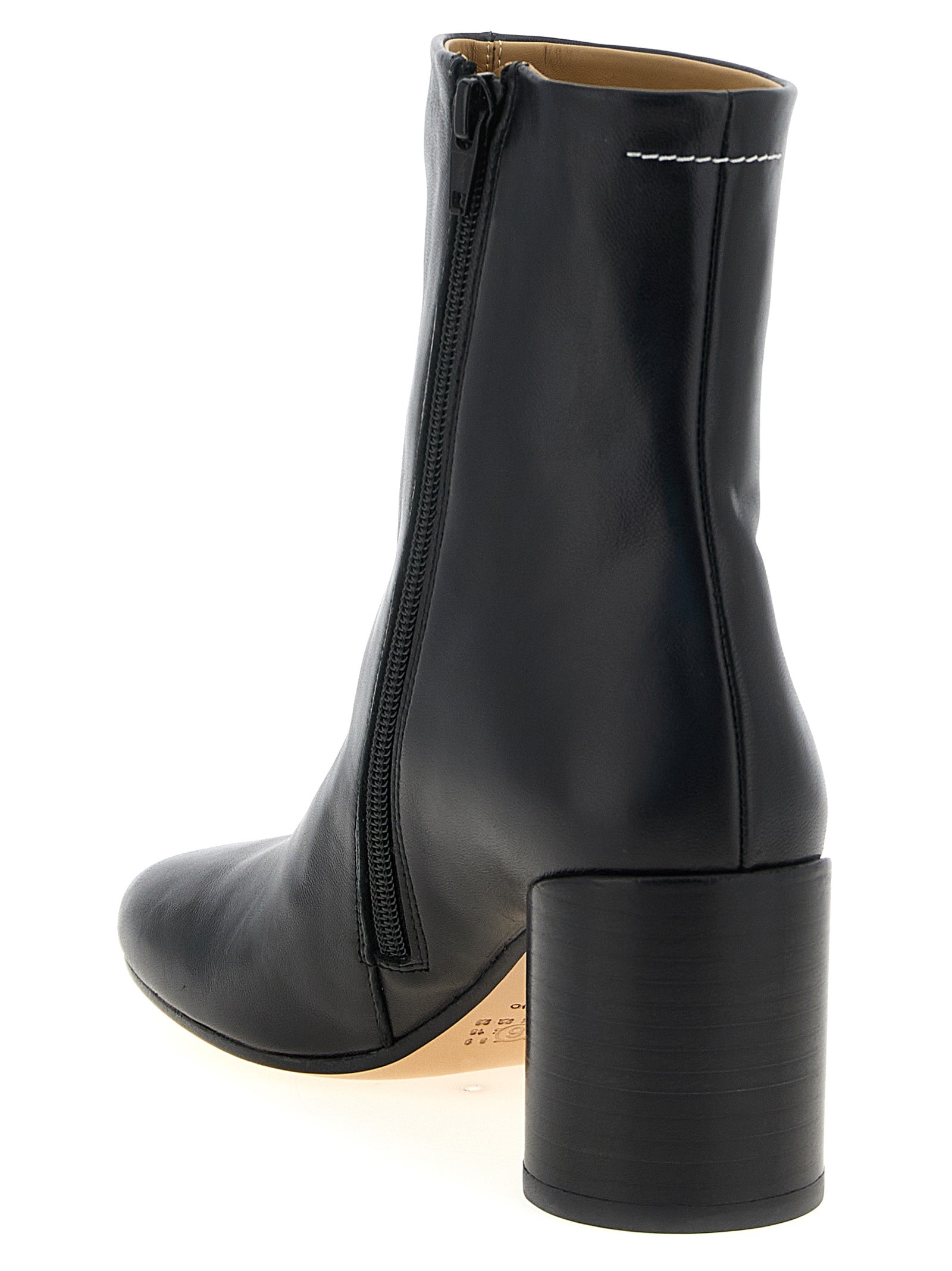 Ankle Boots by MM6 Maison Margiela for women in polyester nappa leather black, white & signature features an high-performance silhouette, showcasing the sophisticated design of the Women's Polyester Nappa Leather Ankle Boots with a block-heel and a refined .