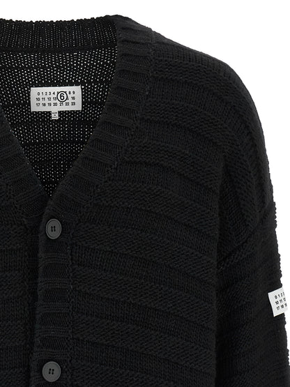 Cardigan by MM6 Maison Margiela for men in acrylic virgin wool black, white & signature features a dramatic silhouette, showcasing a sophisticated v-neck neckline and dramatic detail for a timeless, premium look.