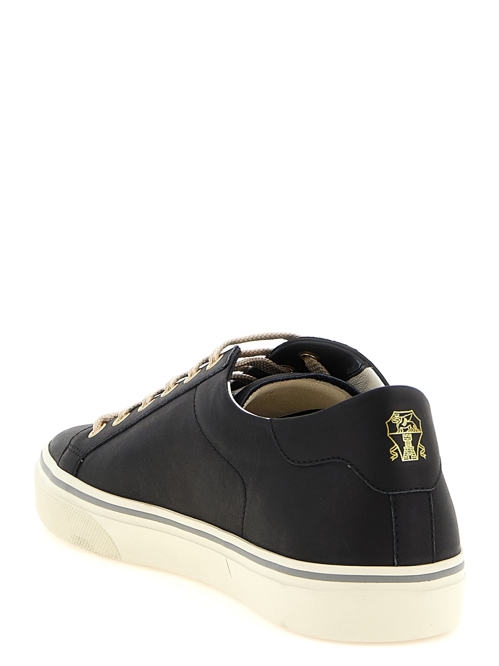 Sneakers by Brunello Cucinelli for men in calfskin leather black, gold & striped presents a impeccable silhouette as Men's Low Top Calfskin Leather Sneakers, expertly defined by a impeccable low-top style for a impeccable, high-fashion look.