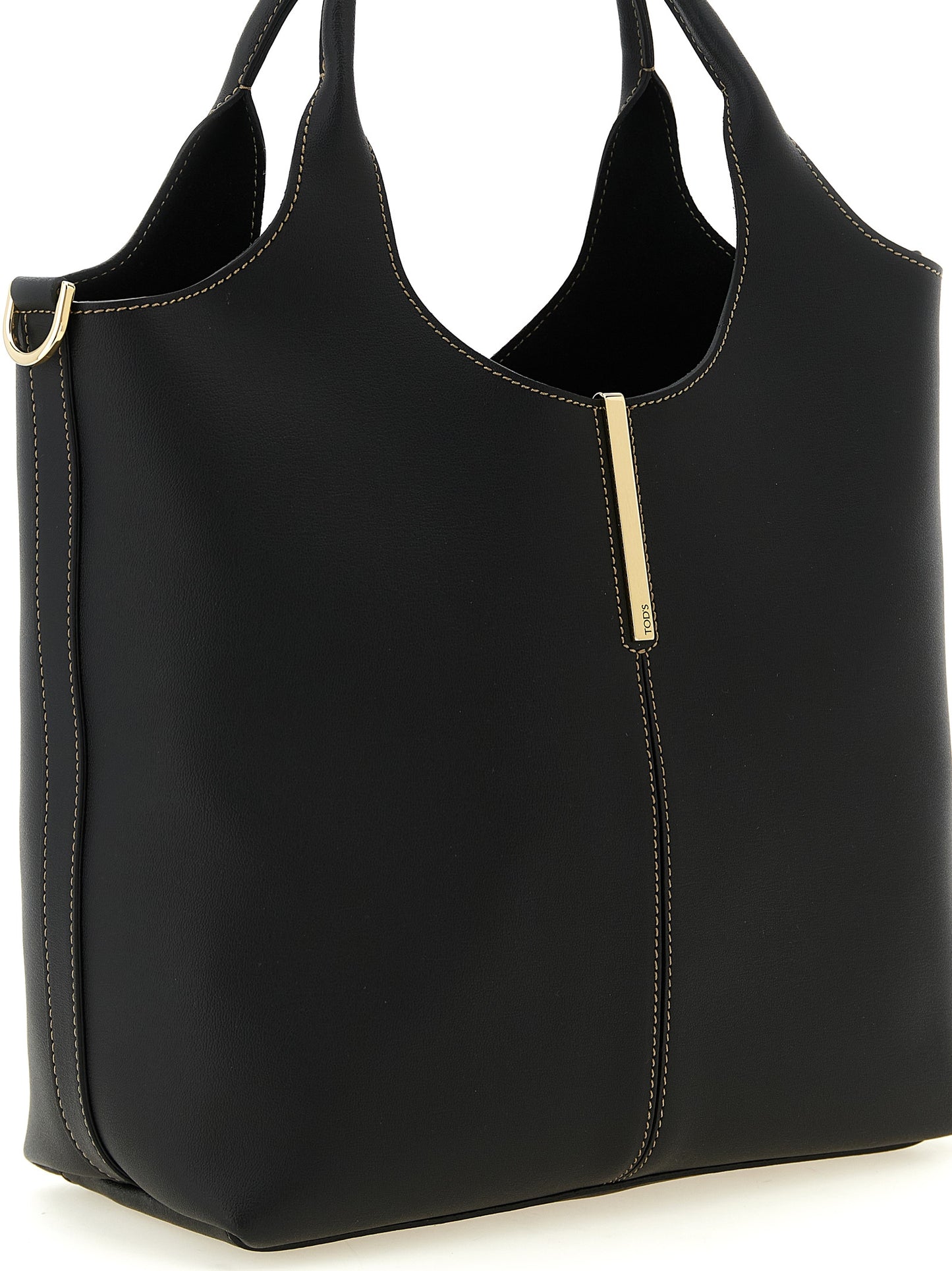 This Small Tote Bag by Tod's for women in calfskin leather black & gold features an on trend Calfskin Leather Small Tote Bag design with a secure hook, ample , and on trend shoulder-strap, handle & detachable-strap.