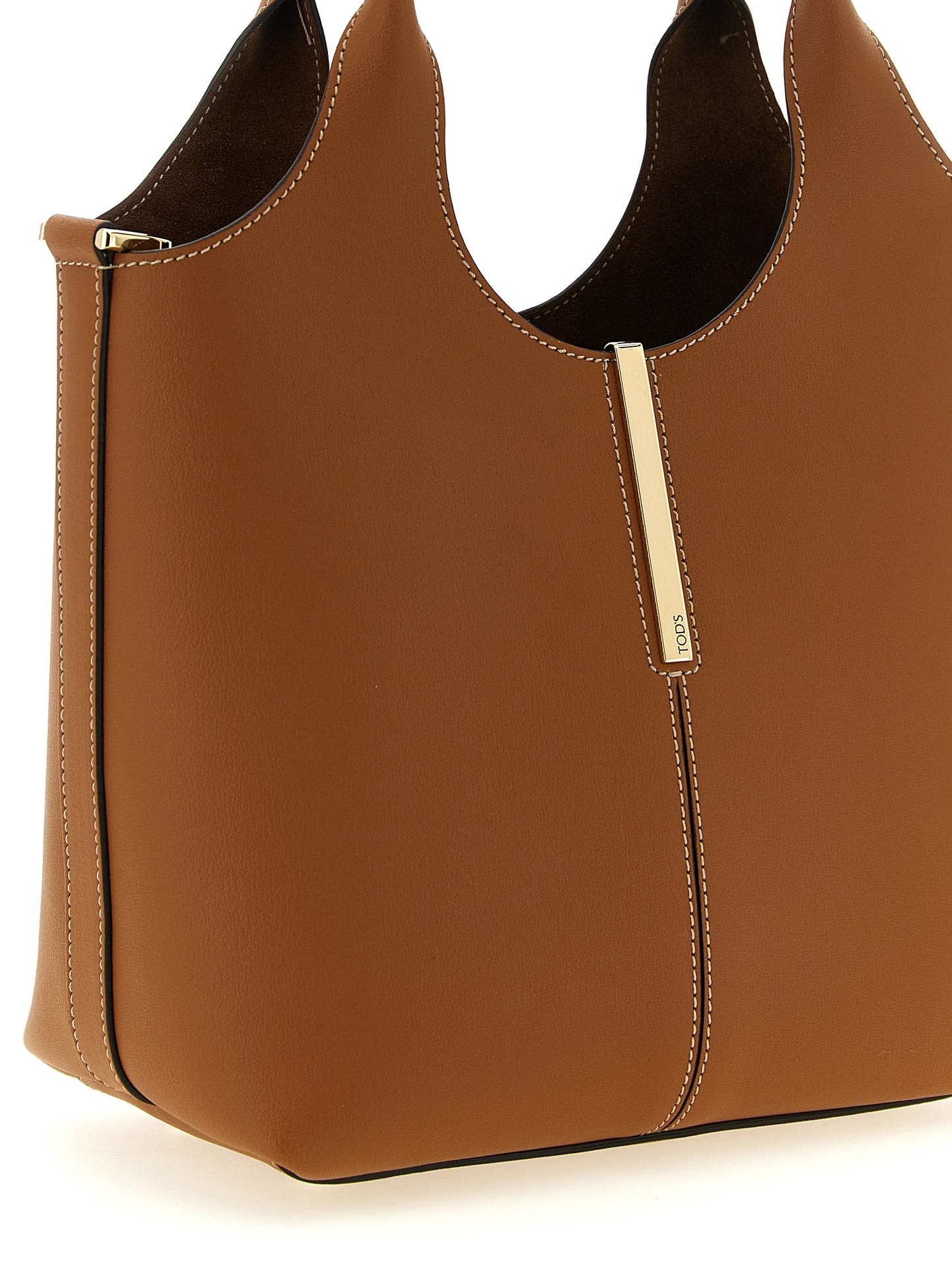Mni Tote Bag by Tod's for women in calfskin leather brown & gold features an jet-setting Calfskin Leather Mni Tote Bag design with a secure , jet-setting , and versatile shoulder-strap & handle for a jet-setting look.