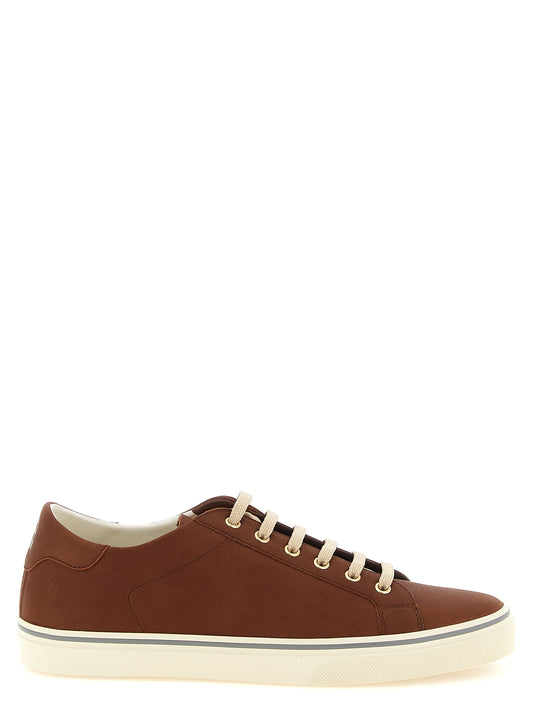 Sneakers by Brunello Cucinelli for men in bos taurus calfskin leather brown & gold features an timeless silhouette from the Men's Low Top Bos Taurus Calfskin Leather Sneakers collection, showcasing a signature low-top style with an timeless finish.