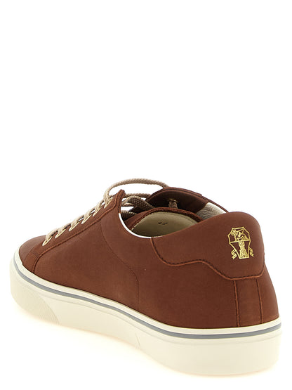 Sneakers by Brunello Cucinelli for men in bos taurus calfskin leather brown & gold features a chic design, perfectly showcasing the chic low-top style of this Men's Low Top Bos Taurus Calfskin Leather Sneakers.