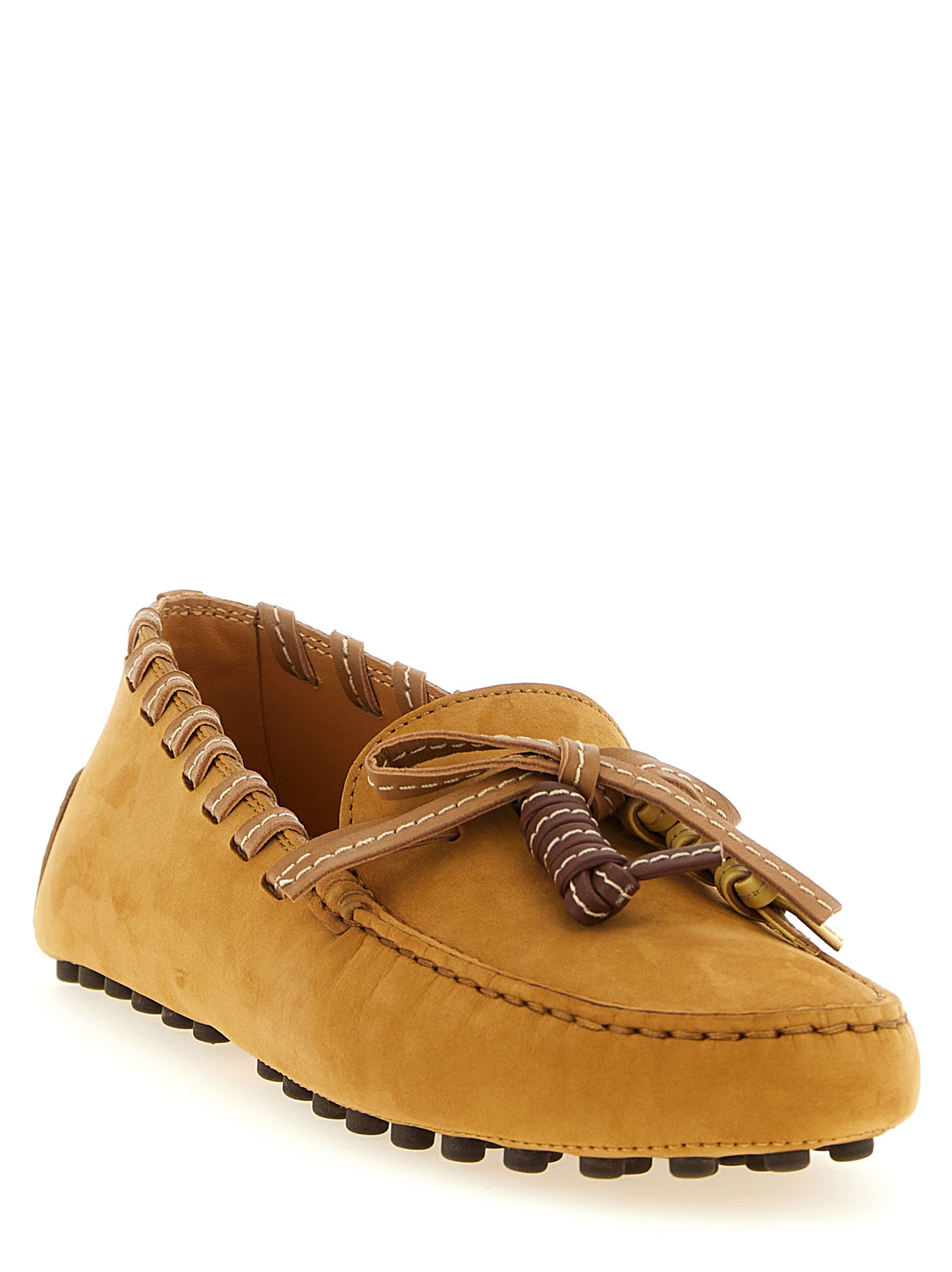 Flat Loafer Slip-On Shoes by Tod's for women in nubuck calfskin leather beige showcases a timeless silhouette from the Women's Nubuck Calfskin Leather Flat Loafer Slip-On Shoes collection, featuring a timeless flat and for a timeless finish.
