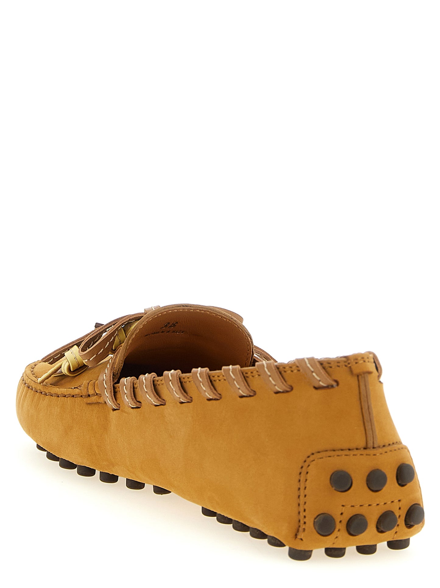 Flat Loafer Slip-On Shoes by Tod's for women in nubuck calfskin leather beige features an effortless chic silhouette, showcasing the Women's Nubuck Calfskin Leather Flat Loafer Slip-On Shoes design with an effortless chic flat and a for a effortless chic look.