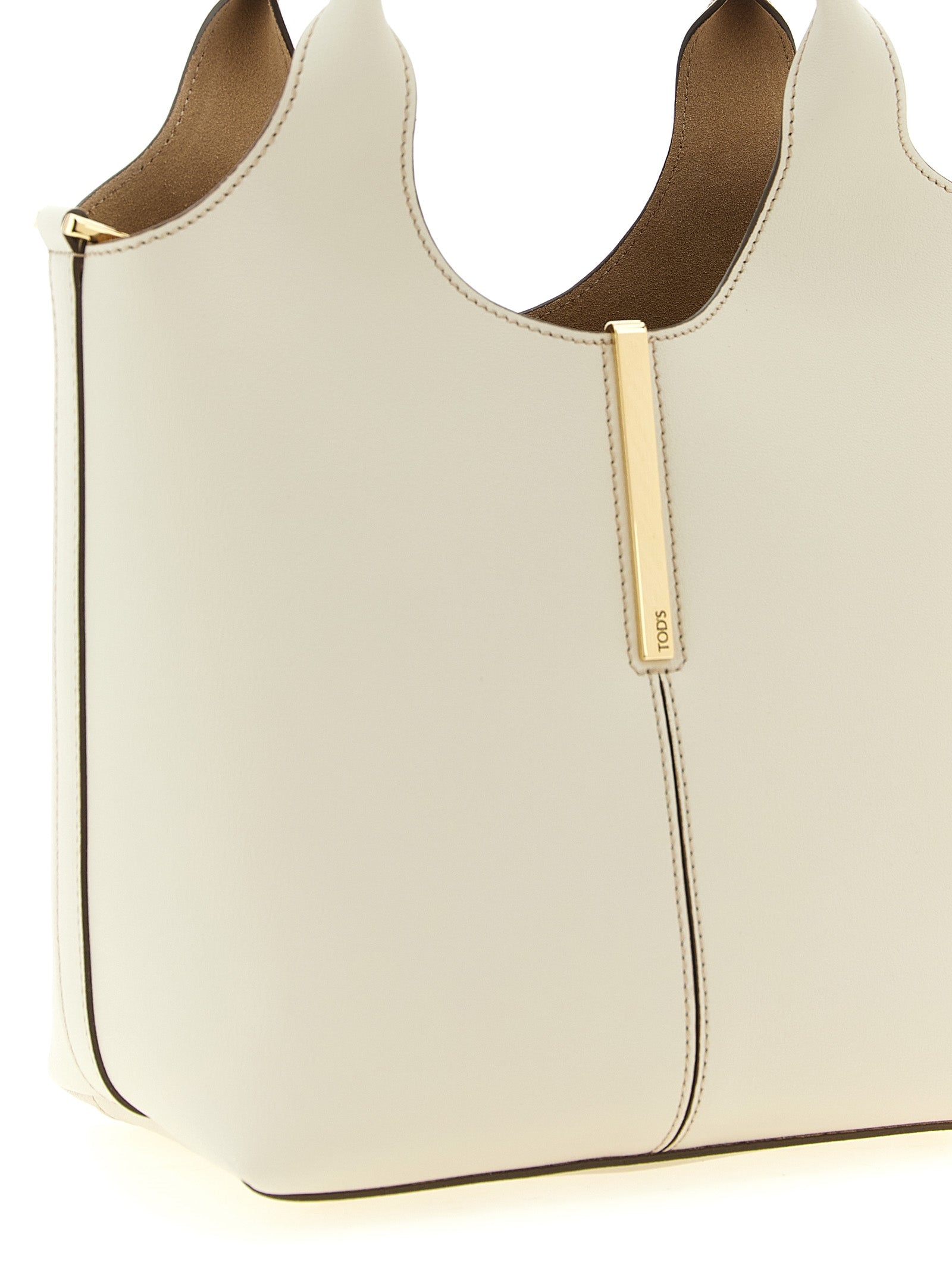 Mni Tote Bag by Tod's for women in suede calfskin leather cream, gold & white features an sumptuous Suede Calfskin Leather Mni Tote Bag design with a secure hook, ample , and versatile shoulder-strap, handle & adjustable-strap for an sumptuous finish.
