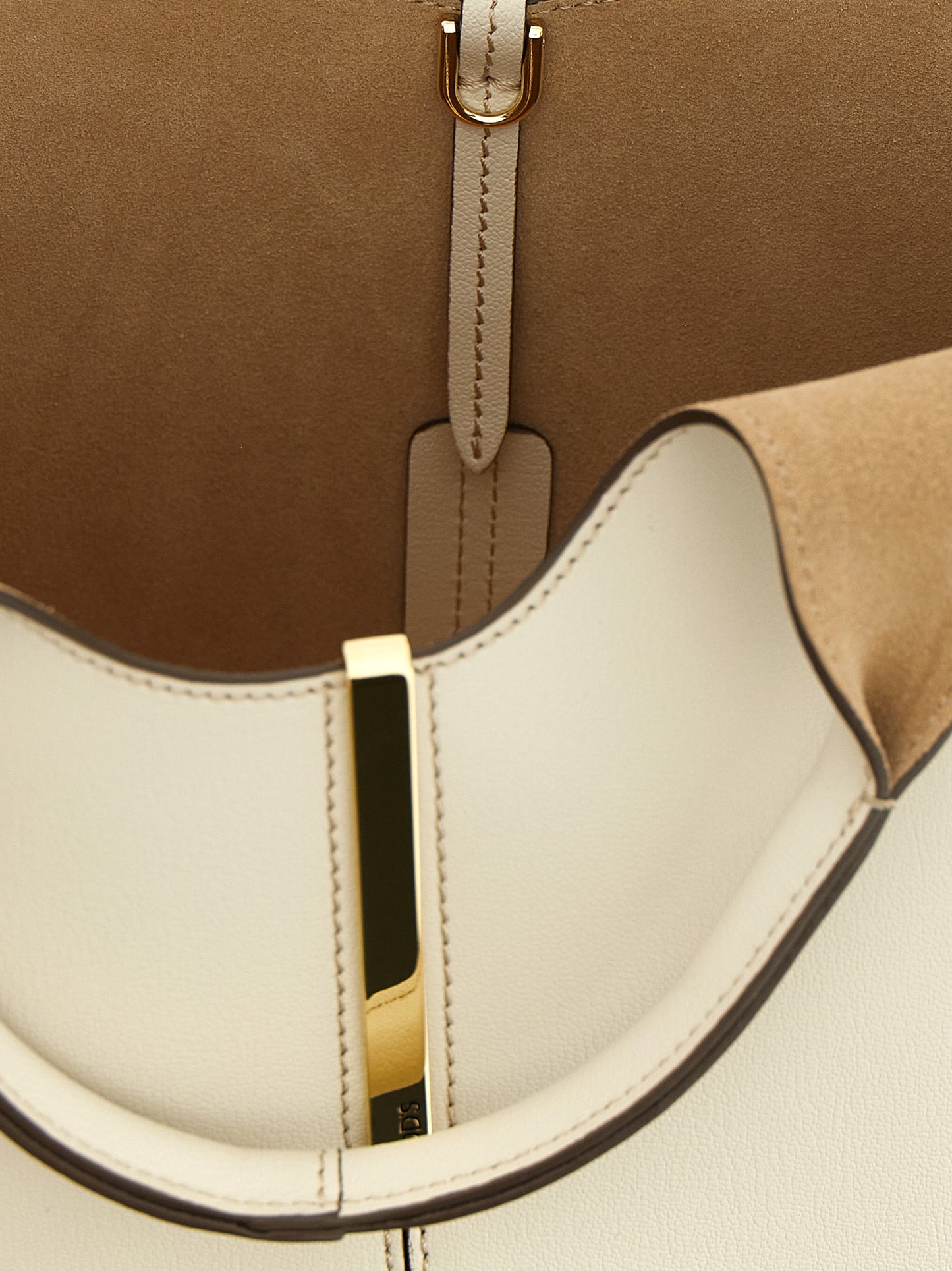 Mni Tote Bag by Tod's for women in suede calfskin leather cream, gold & white showcases a urban-chic Suede Calfskin Leather Mni Tote Bag design, featuring a secure hook, ample , and versatile shoulder-strap, handle & adjustable-strap for a urban-chic finish.