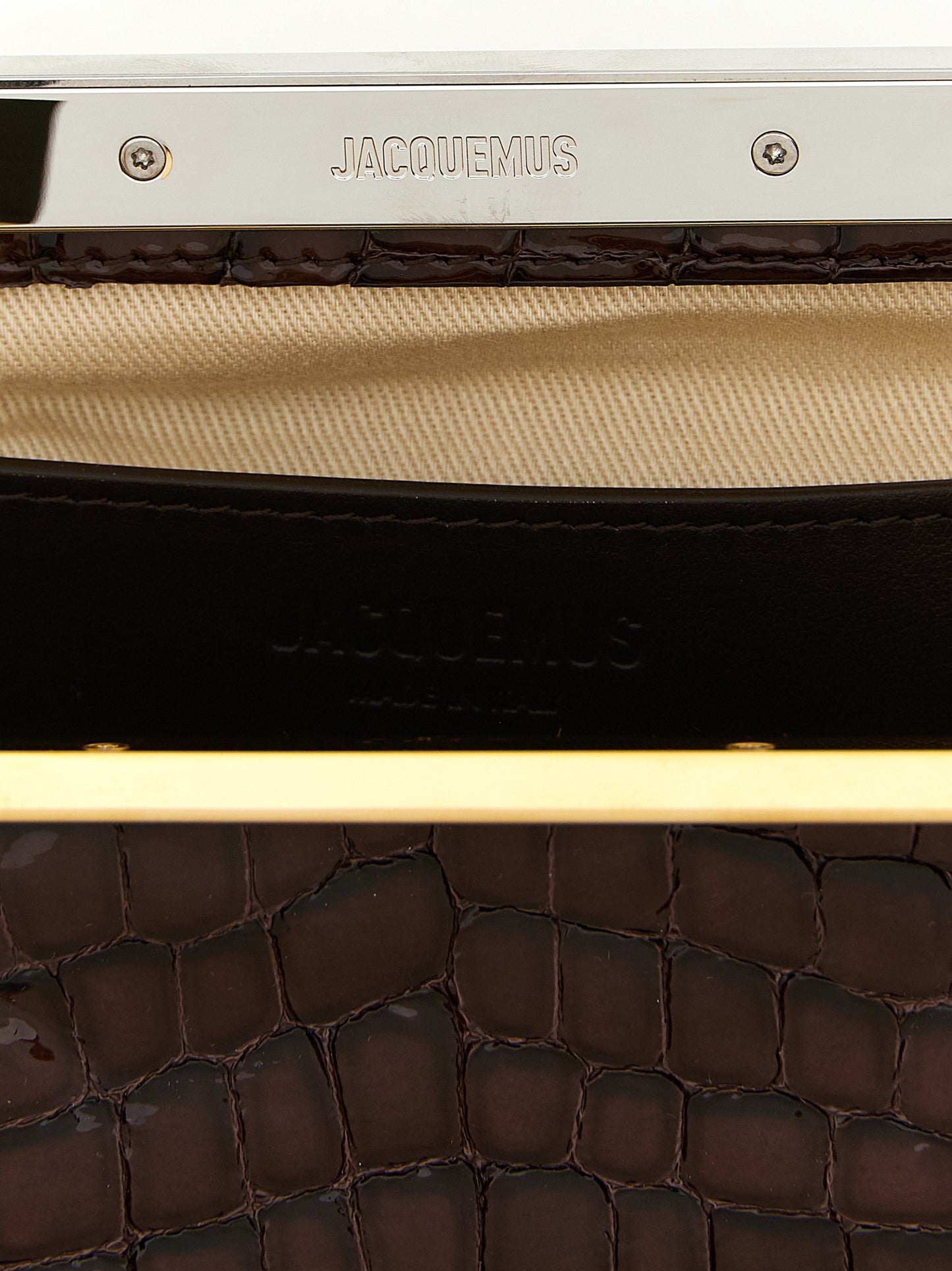 Evening Frame Clutch Handbag by Jacquemus for women in faux crocodile skin leather brown, gold & silver showcases a sculptural silhouette, featuring a secure , ample , and versatile handle for a sculptural finish.