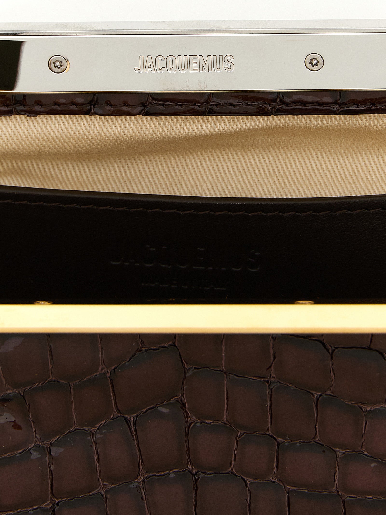 Evening Frame Clutch Handbag by Jacquemus for women in faux crocodile skin leather brown, gold & silver showcases a sculptural silhouette, featuring a secure , ample , and versatile handle for a sculptural finish.