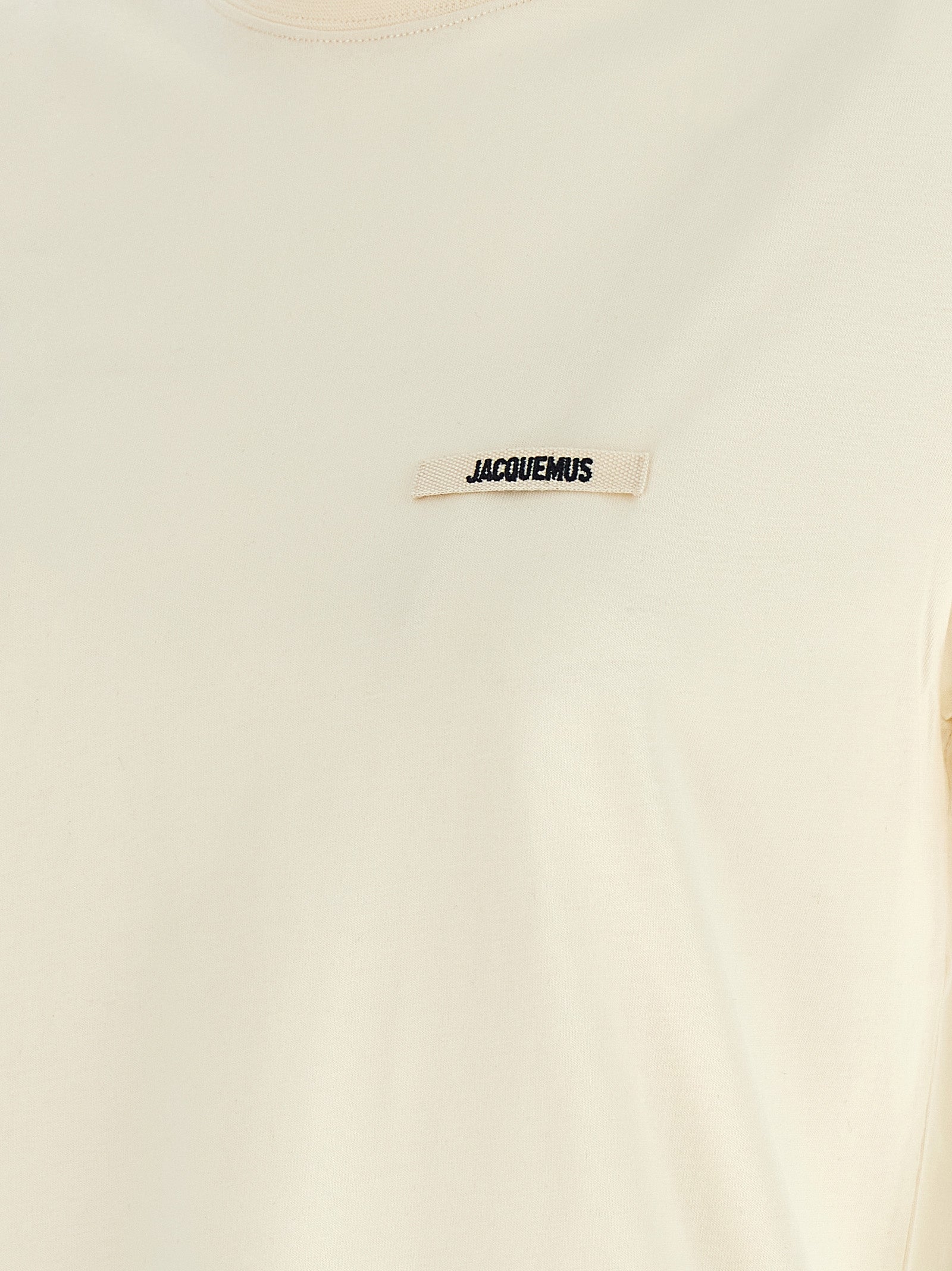T-Shirt by Jacquemus for women in cotton beige, black & signature showcases a unassuming silhouette, artfully detailed with a refined and unassuming for a sophisticated, contemporary look.