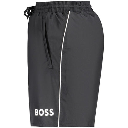 Swim Shorts by Hugo Boss for men in polyester black & print features a resort ready silhouette, perfectly capturing the resort ready aesthetic of Waves Men's Polyester Swim Shorts with a resort ready finish.