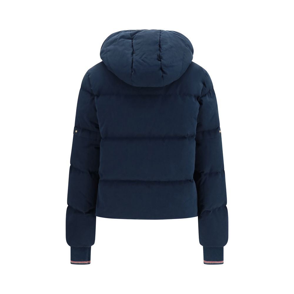 Hooded Puffer Jacket by Thom Browne for women in cotton polyester blue & gold presents a effortlessly chic silhouette, showcasing a sophisticated hooded neckline and premium pockets, hooded & insulated for a truly effortlessly chic finish.