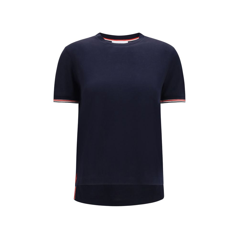 T-Shirt by Thom Browne for women in merino wool blue showcases a unassuming silhouette, artfully detailed with a refined crew neckline and unassuming short-sleeve for a sophisticated, contemporary look.