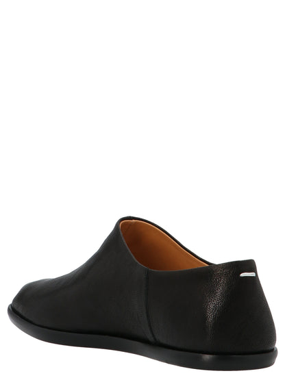 Ballet Flat Shoes by Maison Margiela for women in lamb leather black & signature showcases a dynamic silhouette, artfully capturing Women's Lamb Leather Ballet Flat Shoes through its distinctive and elegant .