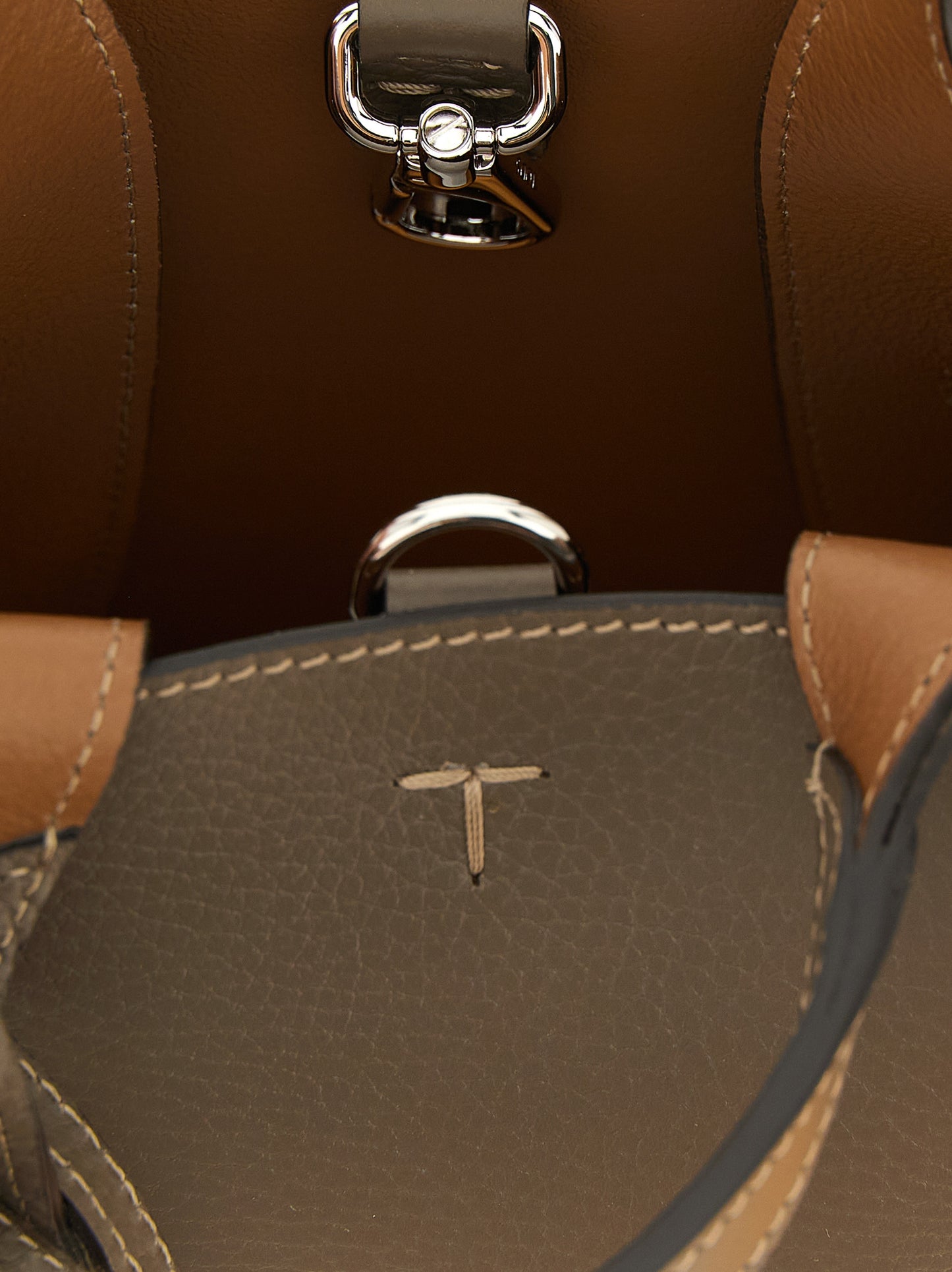 Micro Crossbody Handbag by Tod's for women in calfskin leather bicolour, green, olive, silver & signature features a contemporary silhouette, showcasing a secure , ample , and contemporary crossbody-strap, handle & detachable-strap for a sophisticated look.