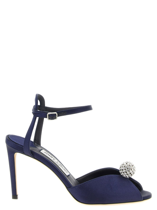 Stiletto Ankle Strap Sandals by Jimmy Choo for women in leather satin & crystal navy features an exquisite silhouette, showcasing the exquisite Women's Leather Satin & Crystal Stiletto Ankle Strap Sandals with a stiletto and peep toe style.