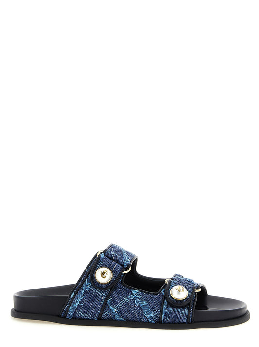 Sliders Sandals Flat Shoes by Jimmy Choo for women in denim blue, gold & pearl features an captivating silhouette, showcasing the captivating style of the Women's Denim Sliders Sandals Flat Shoes with its distinct and refined .