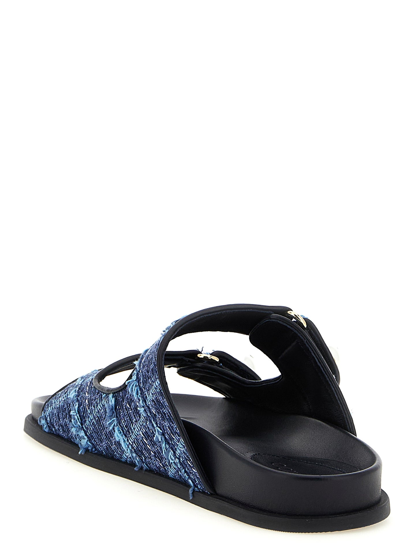 Sliders Sandals Flat Shoes by Jimmy Choo for women in denim blue, gold & pearl presents a effortless chic silhouette, showcasing the Women's Denim Sliders Sandals Flat Shoes design with a effortless chic and for a sophisticated look.