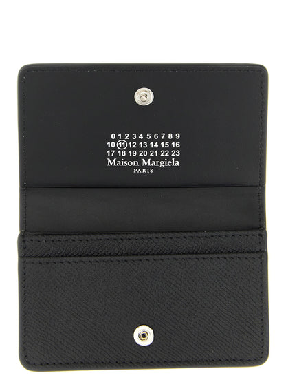 Cardholder Card Case by Maison Margiela for women in calfskin leather black, silver & signature features a sleek silhouette, showcasing the sleek design of the Four Stitches Calfskin Leather Cardholder Card Case with functional card-organization for a premium look.