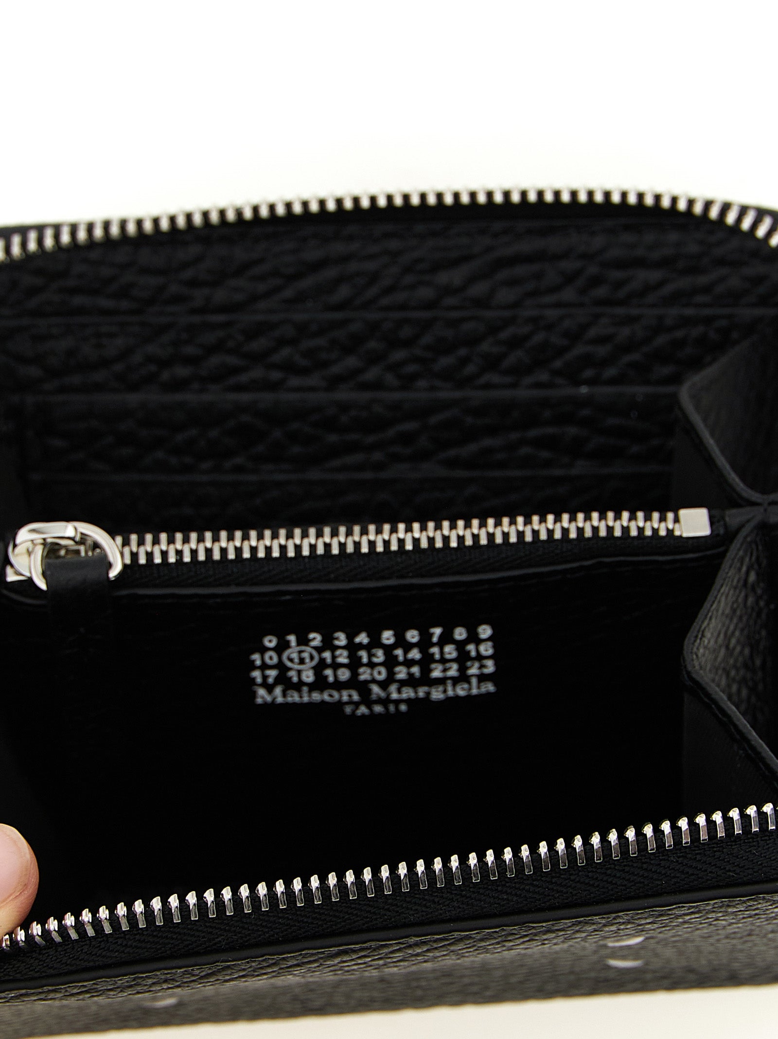 Cardholder Wallet by Maison Margiela for men in calfskin leather black & signature features a streamlined silhouette, showcasing the streamlined Four Stitches Calfskin Leather Cardholder Wallet design with sophisticated card-organization zip-around coin-purse for a premium look.