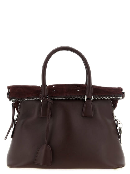 Medium Shoulder Bag by Maison Margiela for women in suede calfskin leather silver features a effortless chic silhouette with a secure , ample , and versatile shoulder-strap for a effortless chic finish.