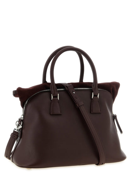 Medium Shoulder Bag by Maison Margiela for women in suede calfskin leather silver showcases a enviable silhouette, artfully detailed with a secure , organized , and versatile shoulder-strap for a enviable look.