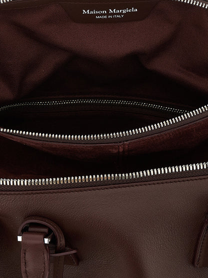 Medium Shoulder Bag by Maison Margiela for women in suede calfskin leather silver features a effortless chic silhouette with a secure , ample , and versatile shoulder-strap for a effortless chic finish.
