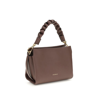 Crossbody Handbag by Coccinelle for women in bos taurus calf leather bicolour & signature presents a ornamental silhouette, showcasing a secure , ample , and versatile crossbody-strap, shoulder-strap, adjustable-strap & handle for a ornamental finish.
