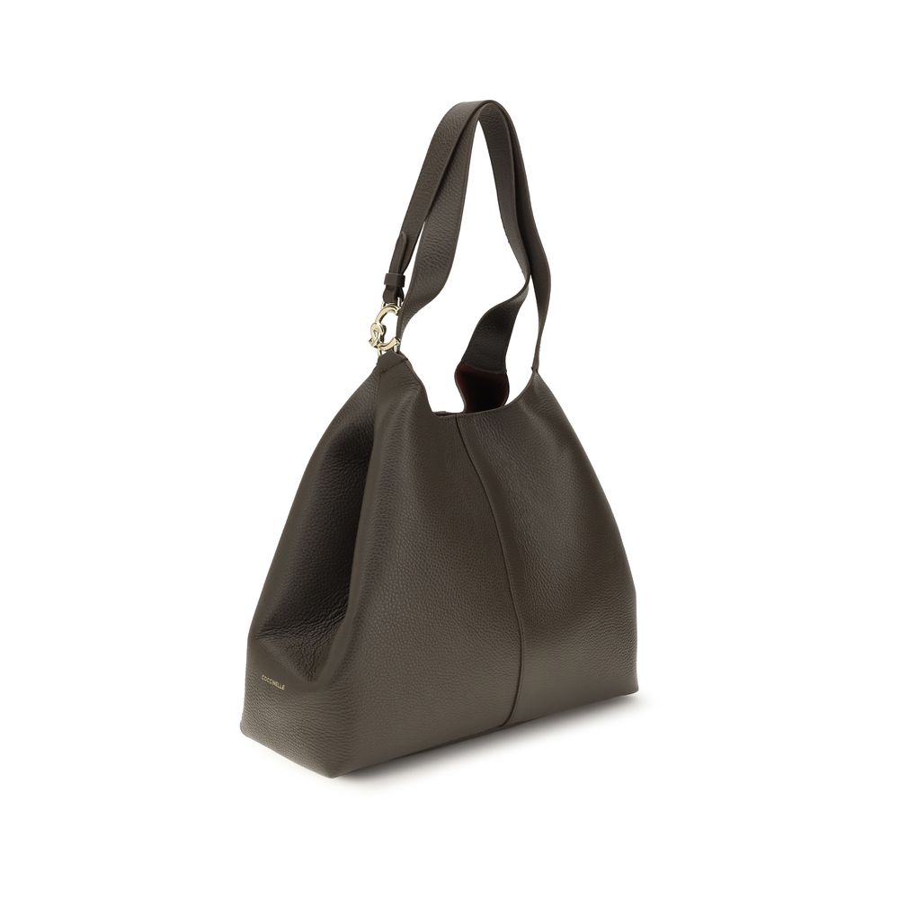 Large Pouch Tote Shoulder Bag by Coccinelle for women in grained bos taurus calf leather brown, gold & signature features a enviable silhouette, showcasing a secure zipper, toggle & button, ample single-compartment, and enviable for a enviable finish.