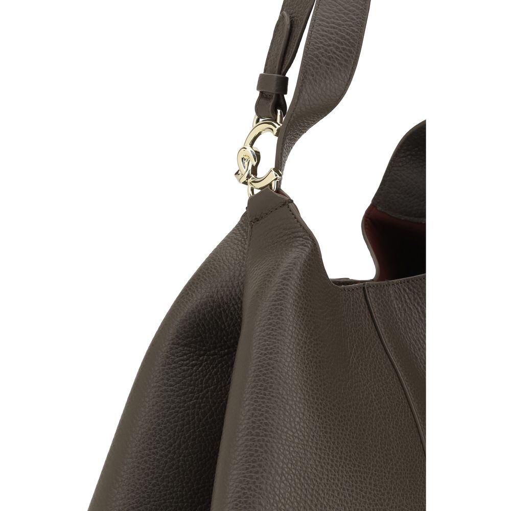Large Pouch Tote Shoulder Bag by Coccinelle for women in grained bos taurus calf leather brown, gold & signature presents a versatile silhouette, showcasing a secure zipper, toggle & button and versatile single-compartment with versatile for a sophisticated look.