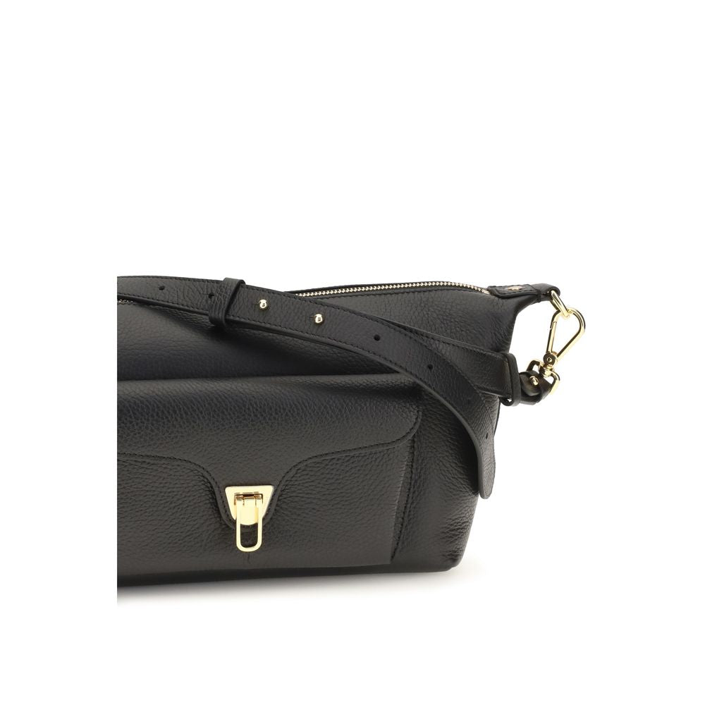 Shoulder Bag by Coccinelle for women in bos taurus calf leather black, gold & signature features a effortless chic silhouette with a secure zipper, ample external-pockets, and versatile shoulder-strap & adjustable-strap for a effortless chic finish.