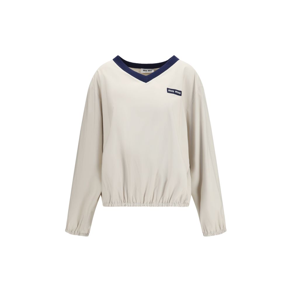 Sweatshirt by Miu Miu for women in polyester beige & jacquard presents a smart casual silhouette, featuring a smart casual v-neck neckline and for a sophisticated look.