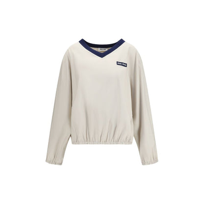 Sweatshirt by Miu Miu for women in polyester beige & jacquard presents a smart casual silhouette, featuring a smart casual v-neck neckline and for a sophisticated look.