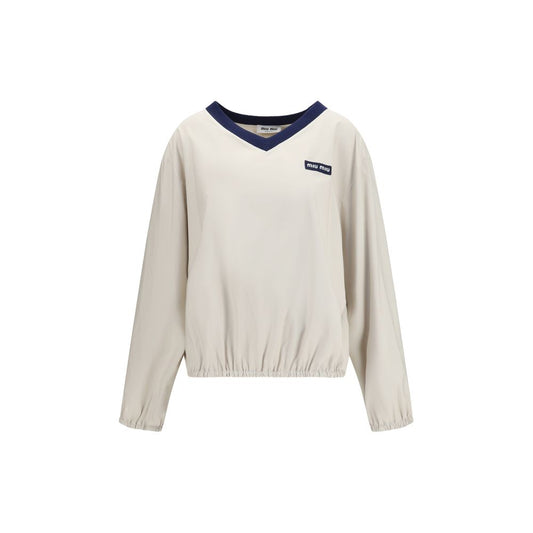 Sweatshirt by Miu Miu for women in polyester beige & jacquard presents a smart casual silhouette, featuring a smart casual v-neck neckline and for a sophisticated look.