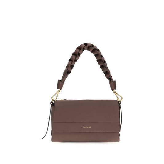 2-in-1 Shoulder & Crossbody Flap Bag by Coccinelle for women in bos taurus calf leather brown & signature features a effortless chic silhouette with a secure flap, zipper & magnetic, ample external-pockets, and versatile crossbody-strap, shoulder-strap, adjustable-strap & handle for a effortless chic finish.