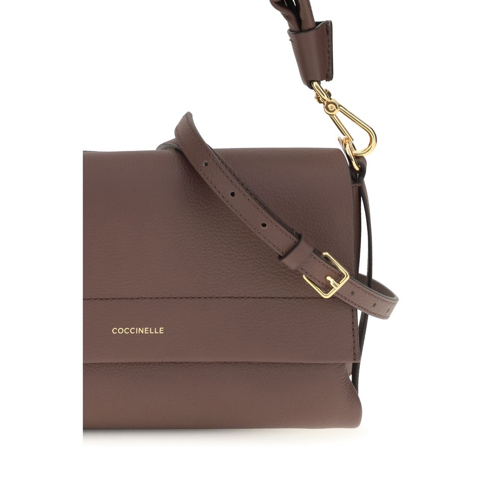 2-in-1 Shoulder & Crossbody Flap Bag by Coccinelle for women in bos taurus calf leather brown & signature presents a versatile silhouette, showcasing a secure flap, zipper & magnetic and versatile external-pockets with versatile crossbody-strap, shoulder-strap, adjustable-strap & handle for a sophisticated look.