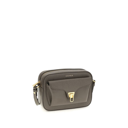 Shoulder Flap Bag by Coccinelle for women in bos taurus calfskin leather brown, gold & monogram showcases a enviable silhouette, artfully detailed with a secure flap & zipper, organized , and versatile shoulder-strap & adjustable-strap for a enviable look.