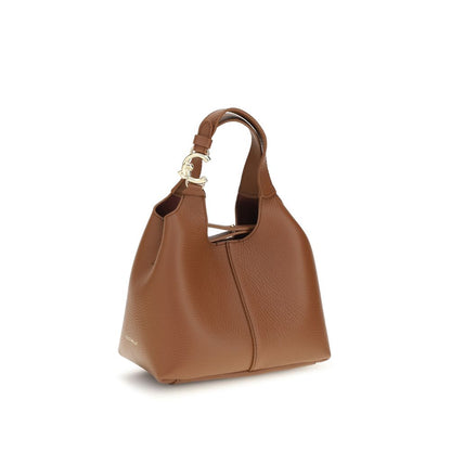 Small Crossbody Pouch Handbag by Coccinelle for women in bos taurus calf grained leather brown & gold features a contemporary silhouette, showcasing a secure zipper & button, ample , and contemporary crossbody-strap, shoulder-strap, handle, adjustable-strap & detachable-strap for a sophisticated look.