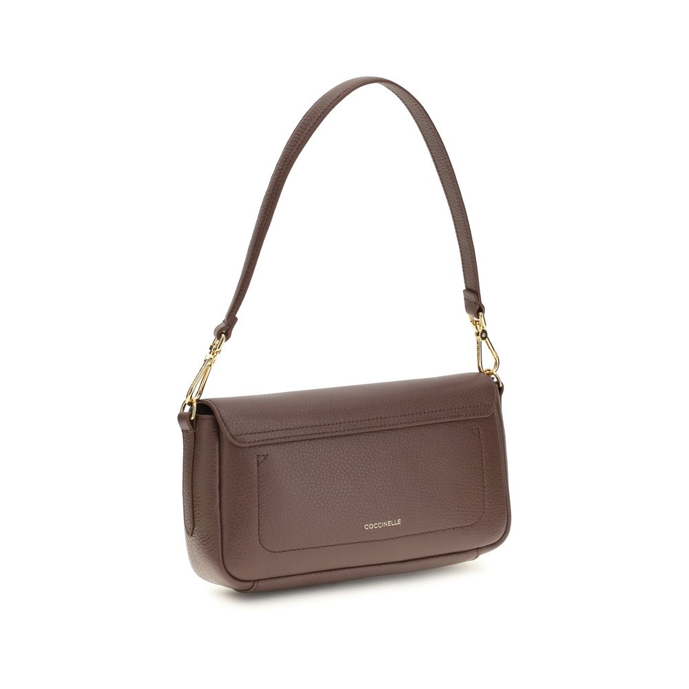 Medium 2-in-1 Shoulder & Crossbody Bag by Coccinelle for women in bos taurus calf grained leather brown & gold features a effortless chic silhouette with a secure , ample , and versatile crossbody-strap, shoulder-strap, adjustable-strap & handle for a effortless chic finish.