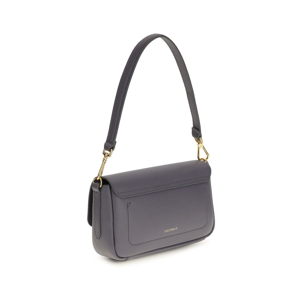 Medium 2-in-1 Shoulder & Crossbody Bag by Coccinelle for women in bos taurus calf grained leather blue & gold features a distinguished silhouette, showcasing a secure and distinguished with versatile crossbody-strap, shoulder-strap, adjustable-strap & handle for a distinguished finish.