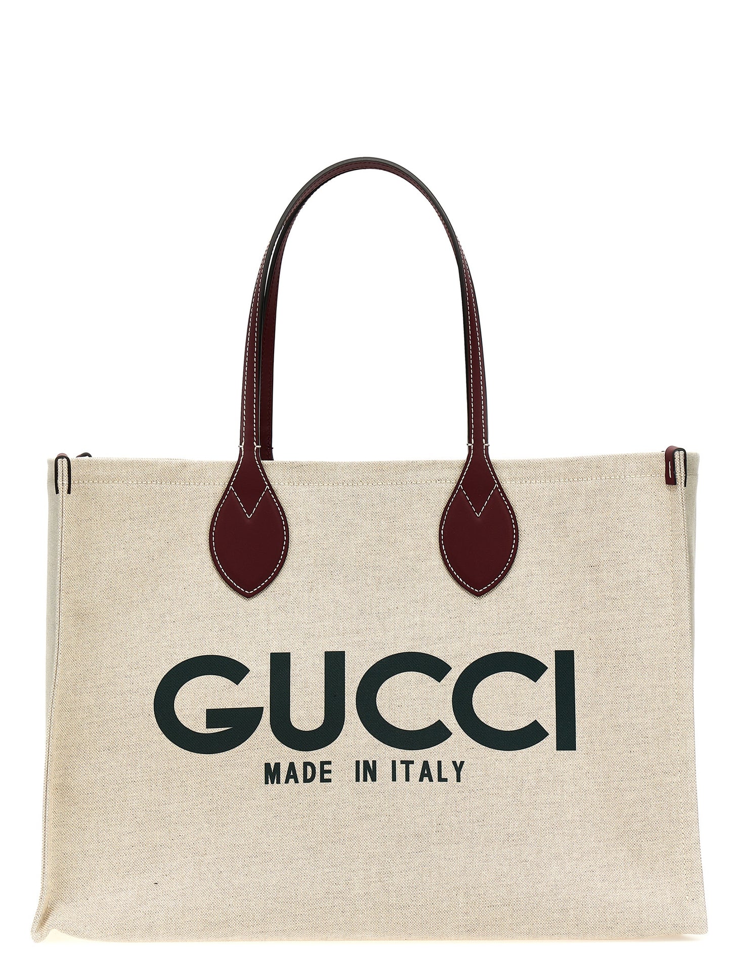 Shopper Tote Clutch Bag by Gucci for women in cotton polyester canvas beige & print features a jet-set Cotton Polyester Canvas Shopper Tote Clutch Bag design, complete with a secure , ample , and versatile handle for a jet-set look.