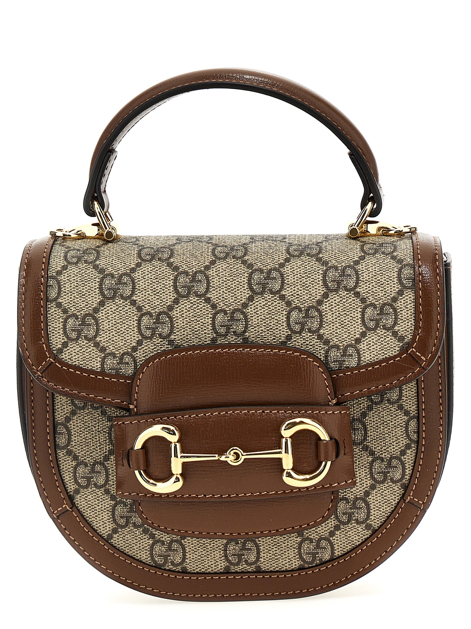This Flap Handbag by Gucci for women in poly cotton & leather and brown & signature presents a sculptural silhouette featuring a secure flap & magnetic, ample , and versatile shoulder-strap & handle for a sculptural finish.