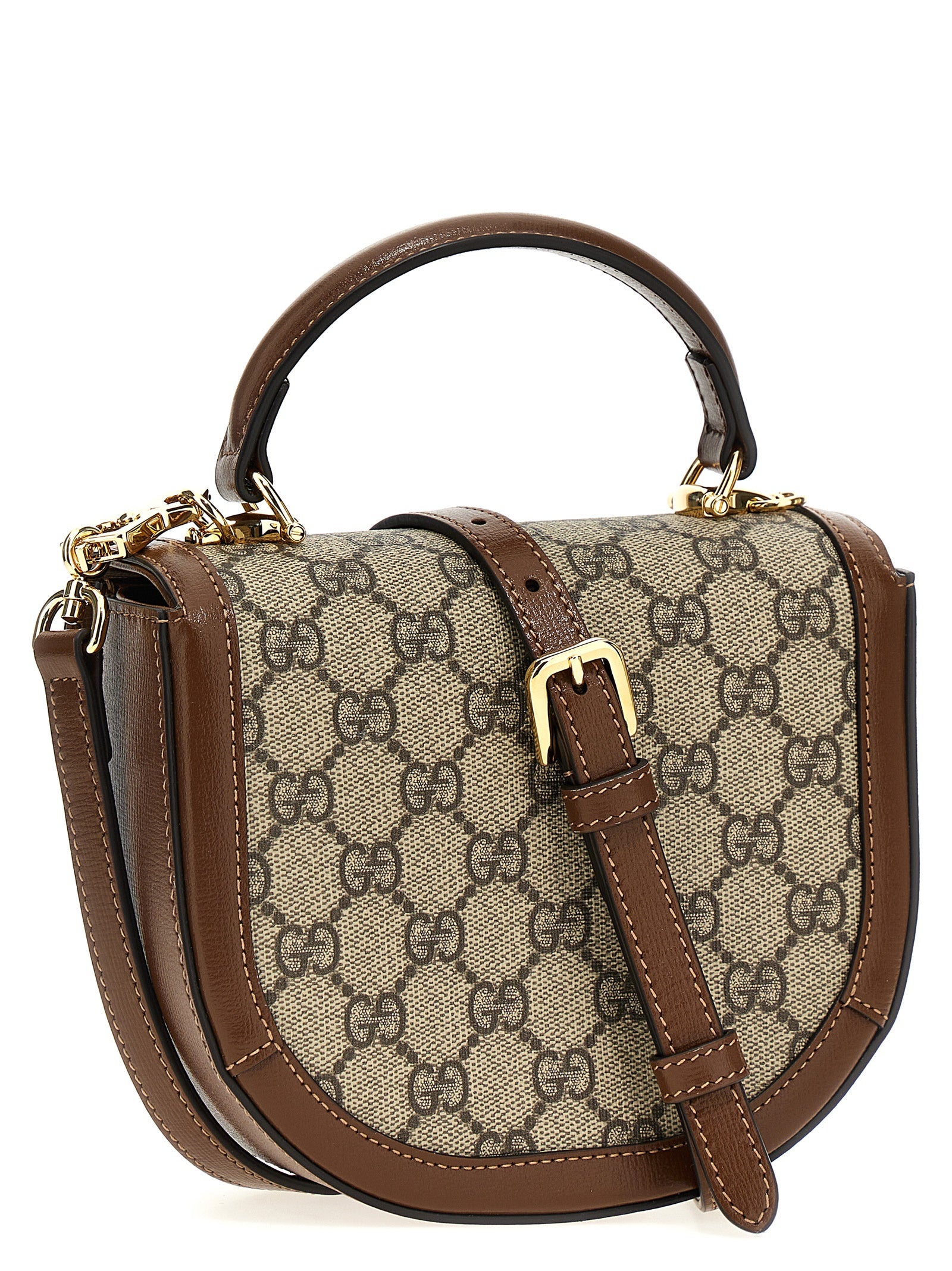 Flap Handbag by Gucci for women in poly cotton & leather brown & signature features an refined silhouette, showcasing a secure flap & magnetic, ample , and versatile shoulder-strap & handle for a sophisticated refined aesthetic.
