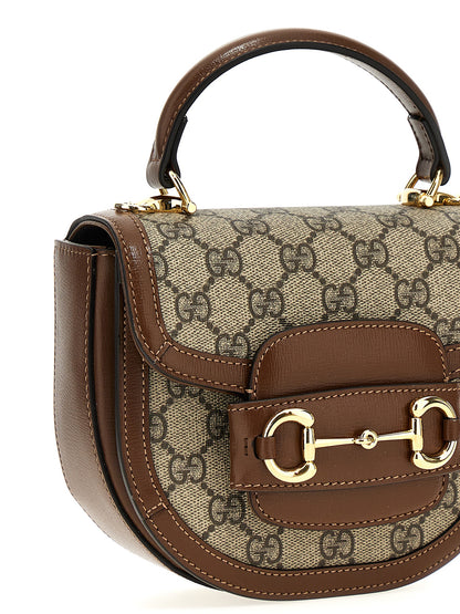 Flap Handbag by Gucci for women in poly cotton & leather brown & signature features a refined silhouette, showcasing a secure flap & magnetic, organized , and versatile shoulder-strap & handle for a refined finish.