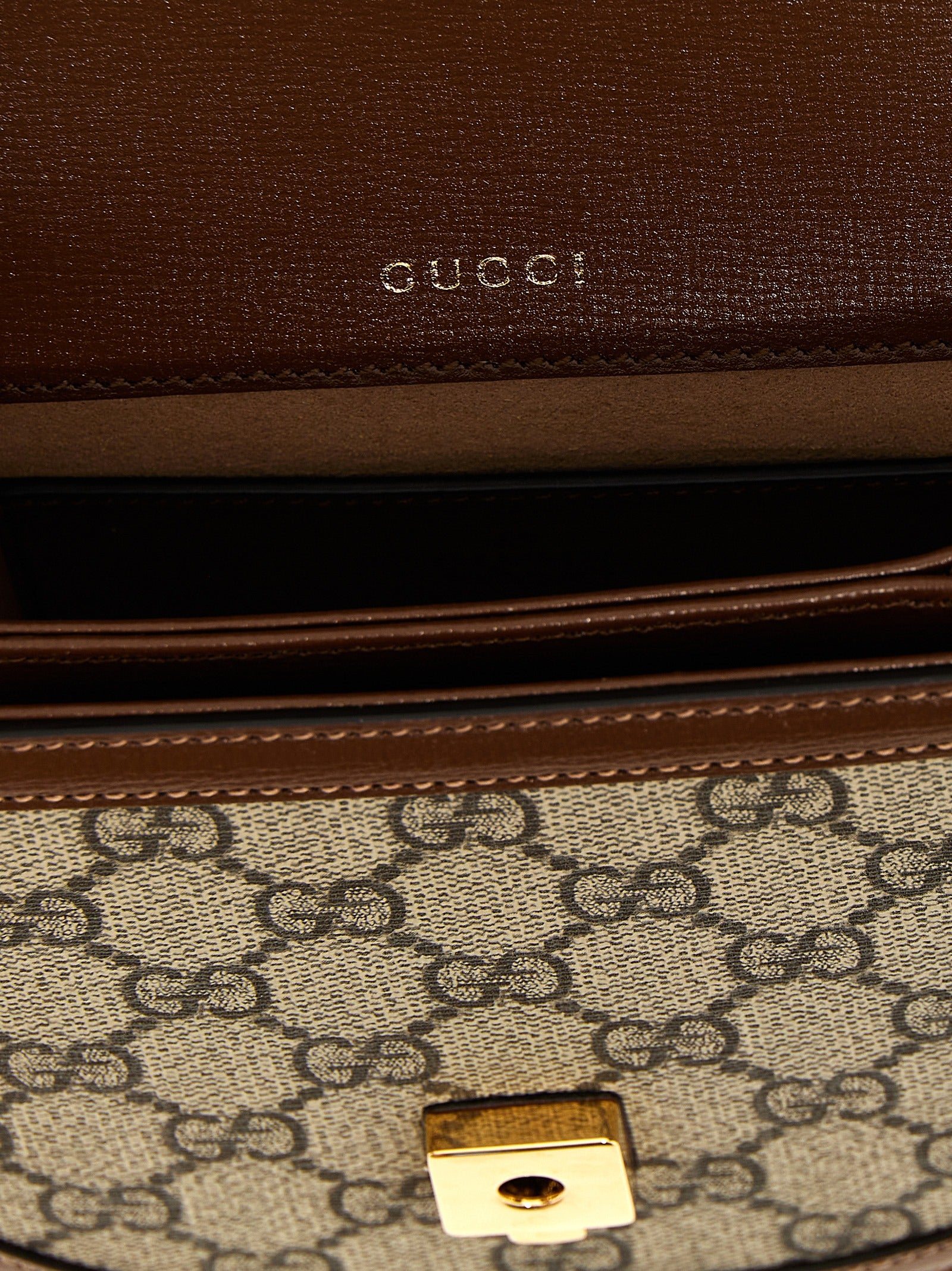 Flap Handbag by Gucci for women in poly cotton & leather brown & signature presents a ornamental silhouette, showcasing a secure flap & magnetic, ample , and versatile shoulder-strap & handle for a ornamental finish.